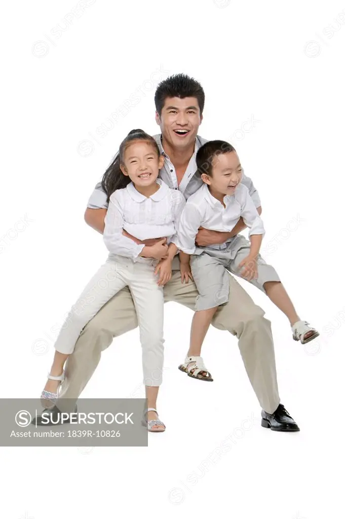 Portrait of father, son and daughter