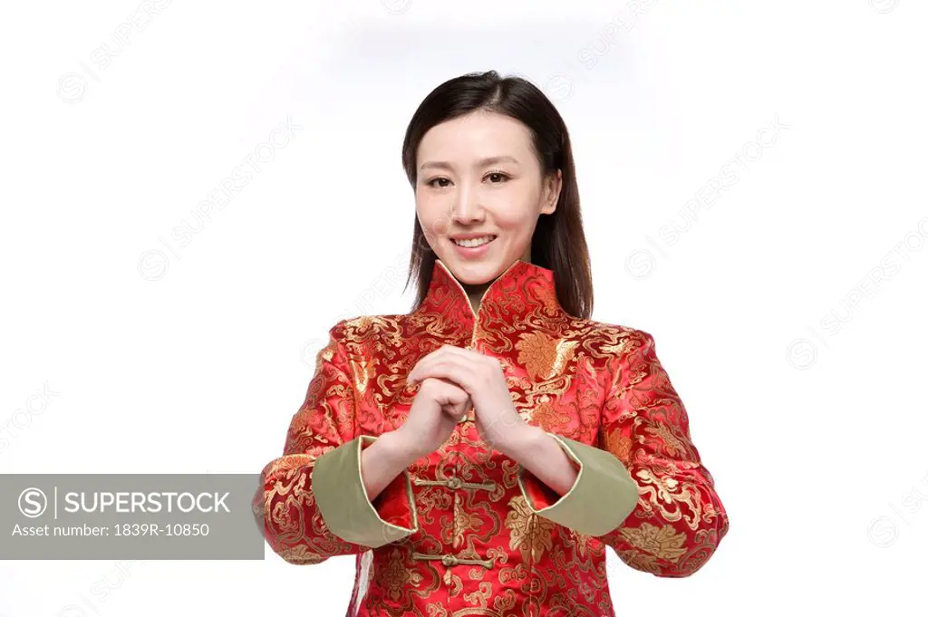 Young woman in Chinese traditional clothes giving best wishes