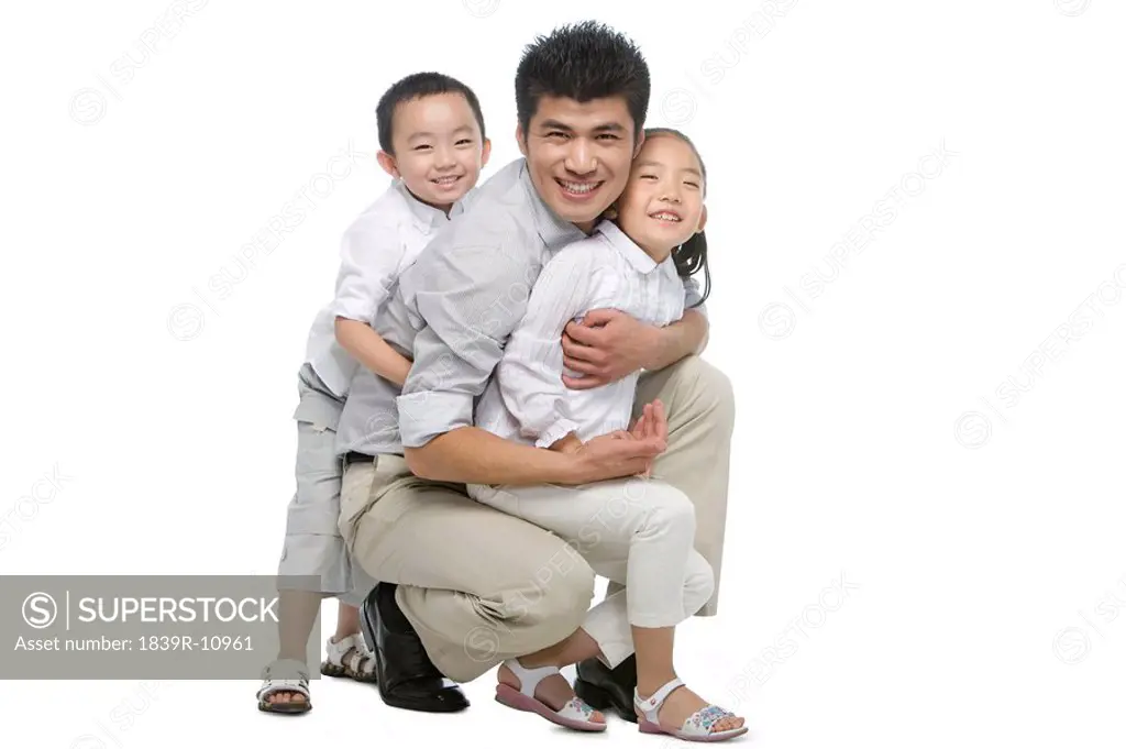Portrait of father, son and daughter