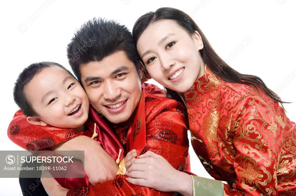 Family of three in Chinese traditional clothes
