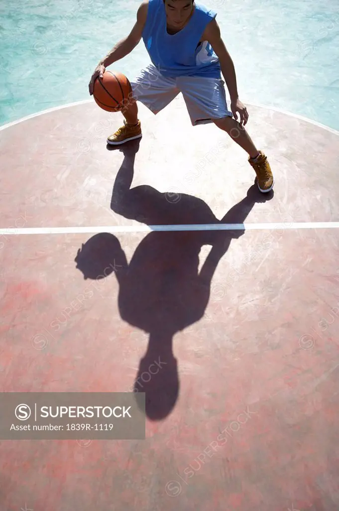 Young Man Playing Basketball