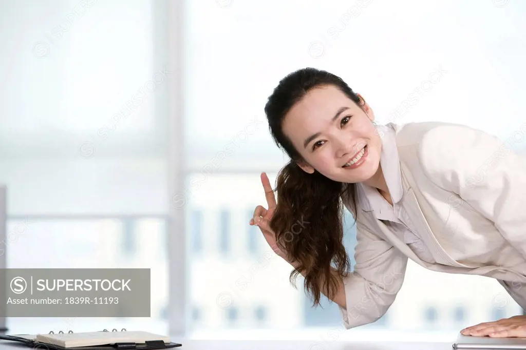 Happy office worker at her desk