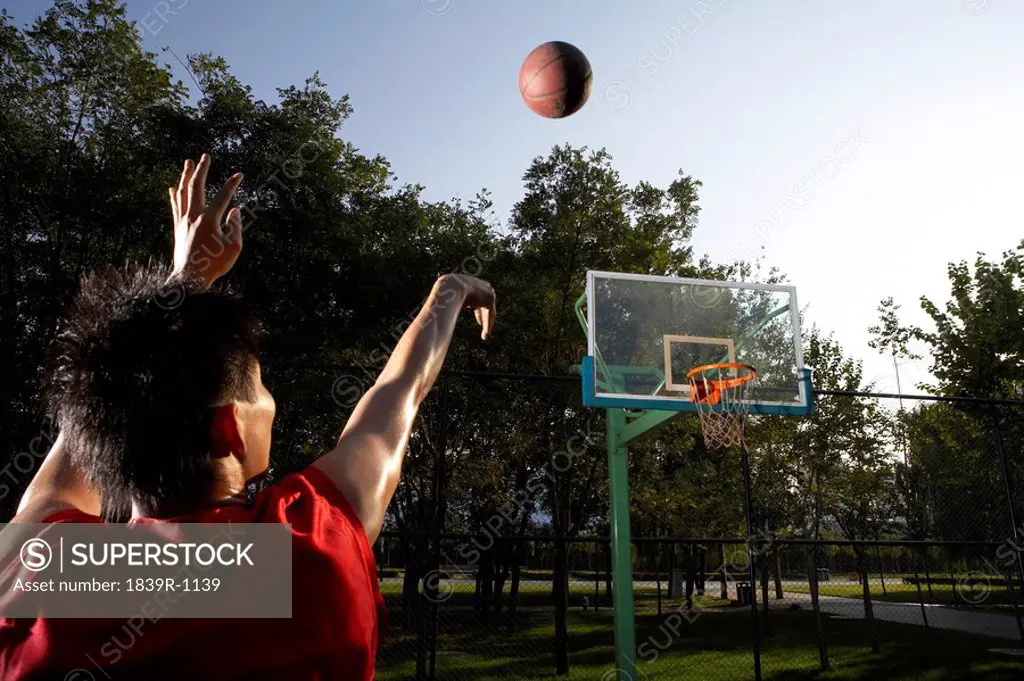 Basketball Player Shooting Hoops
