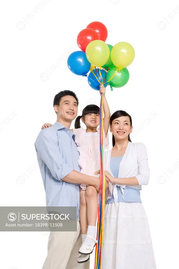 Portrait of family with balloons