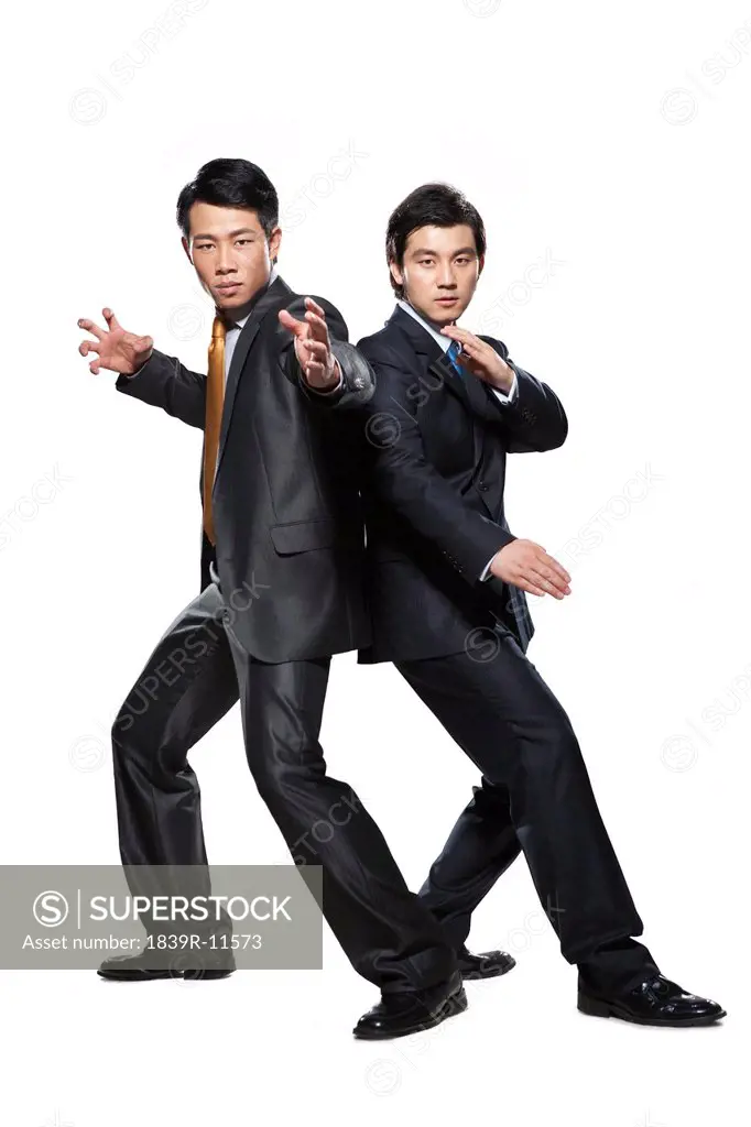 Two businessmen in fighting stance