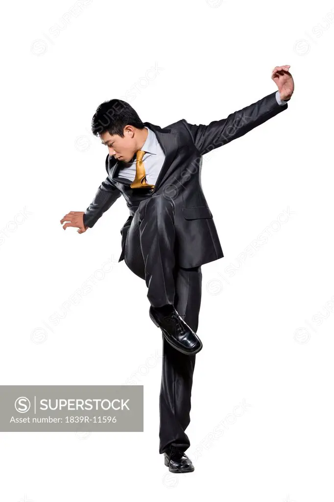 Businessman standing in martial arts stance