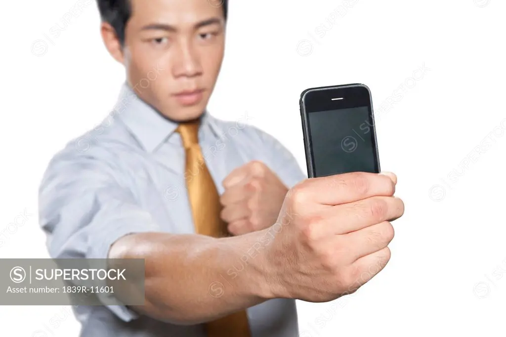 Businessman holding iPhone