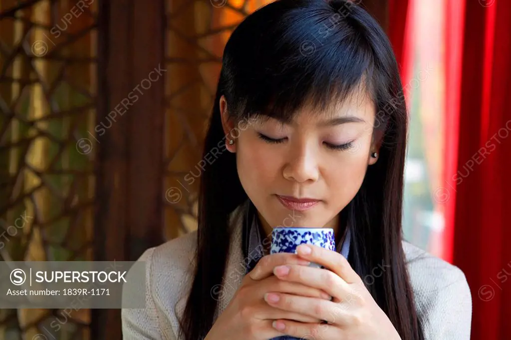 Woman Drinking From Mug