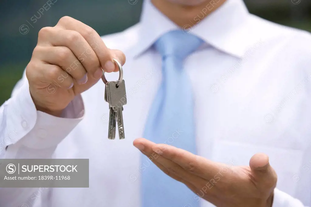 Chinese businessman holding key