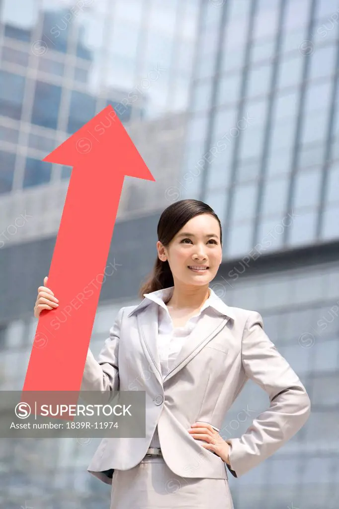 Chinese businesswoman with a red arrow