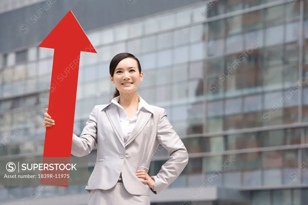 Chinese businesswoman with a red arrow