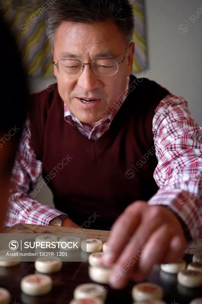 Senior Man Playing Chinese Chess