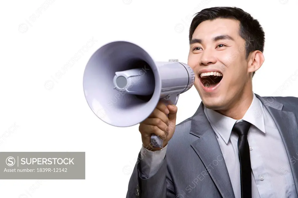 Businessman Shouting Into Megaphone