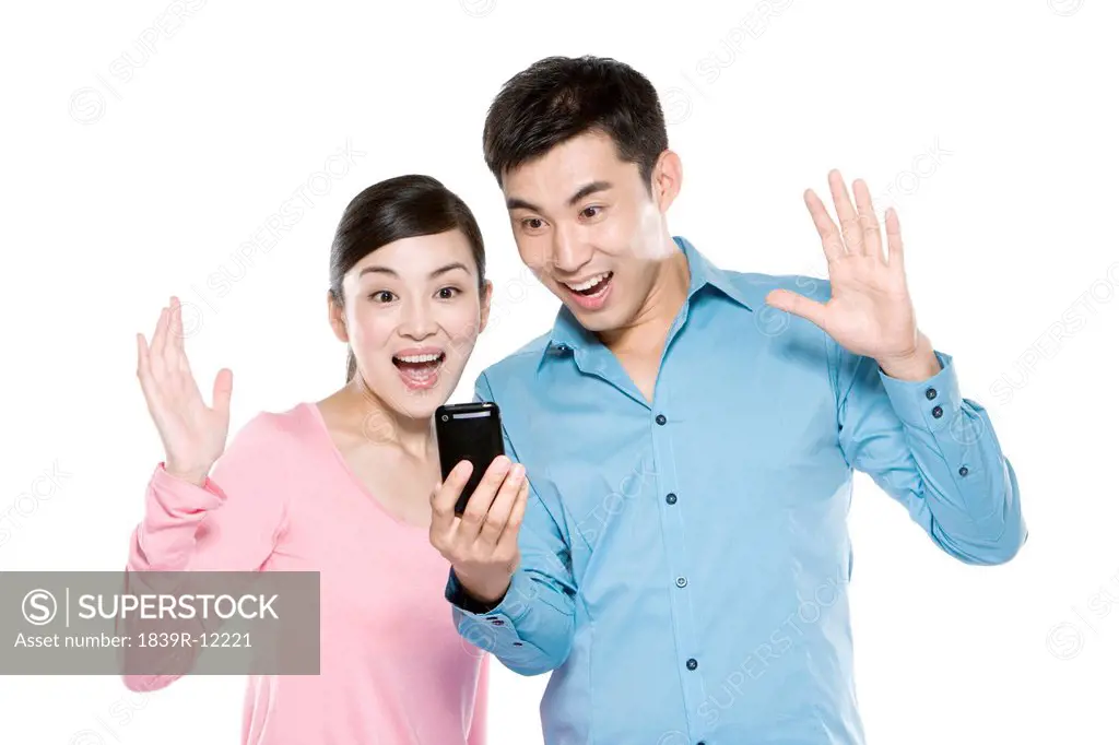 Couple Looking At Phone