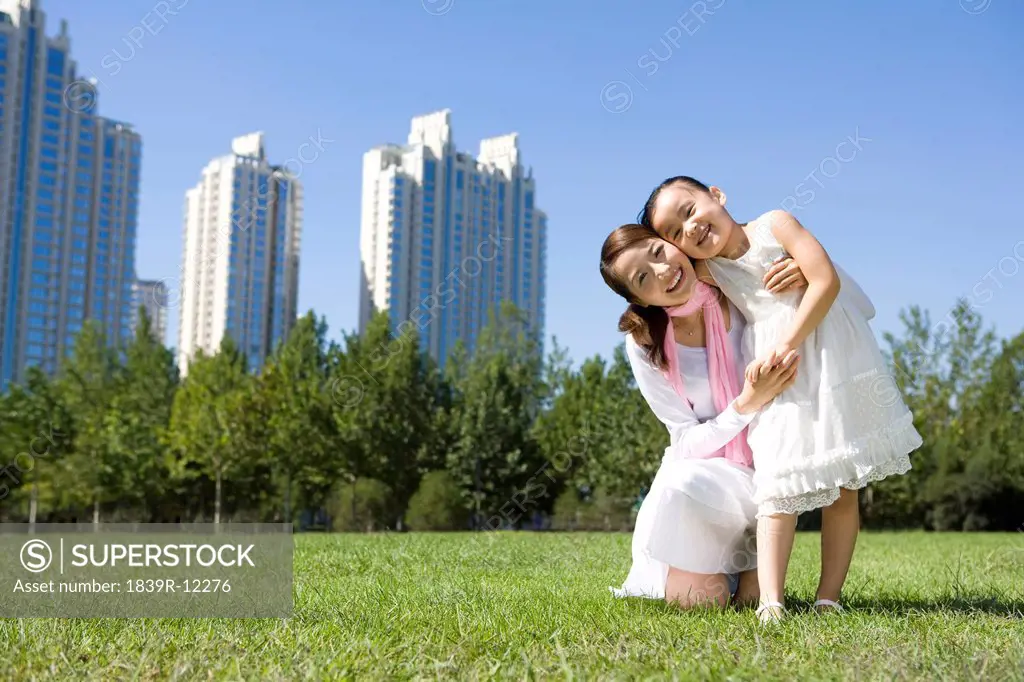 Mother and daughter playing at the park