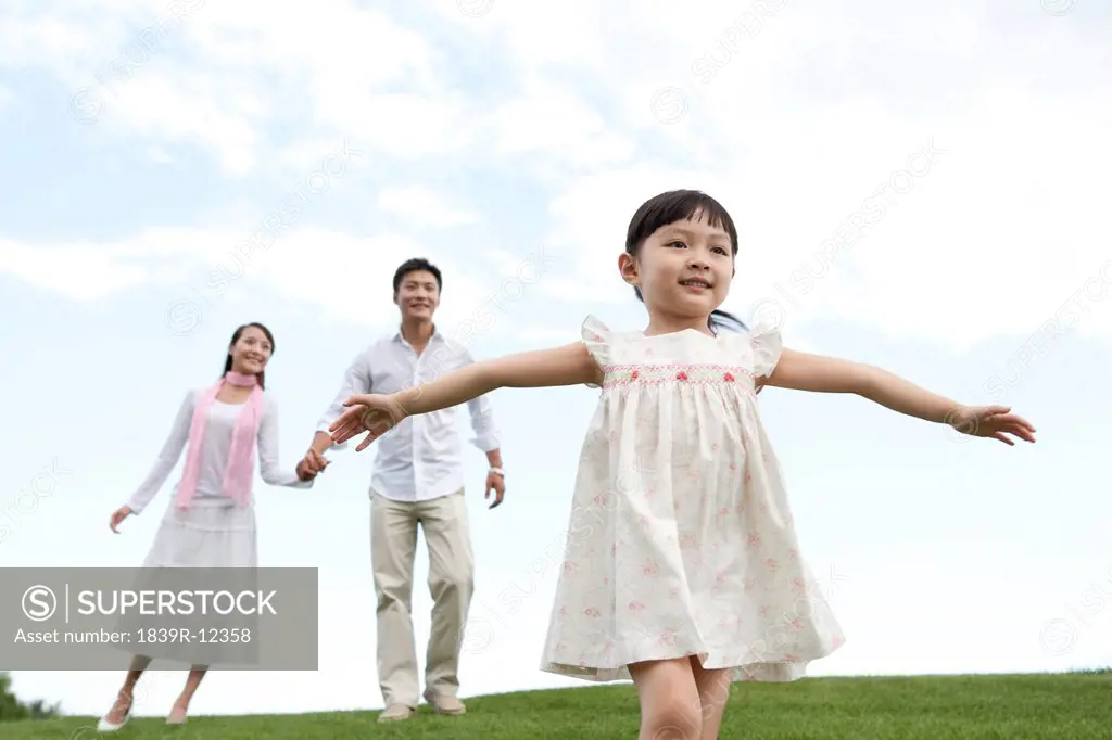 A young family enjoying the park