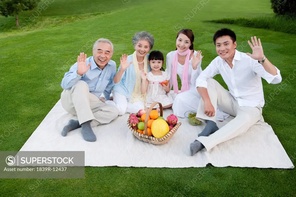 A family gathered around for a picnic