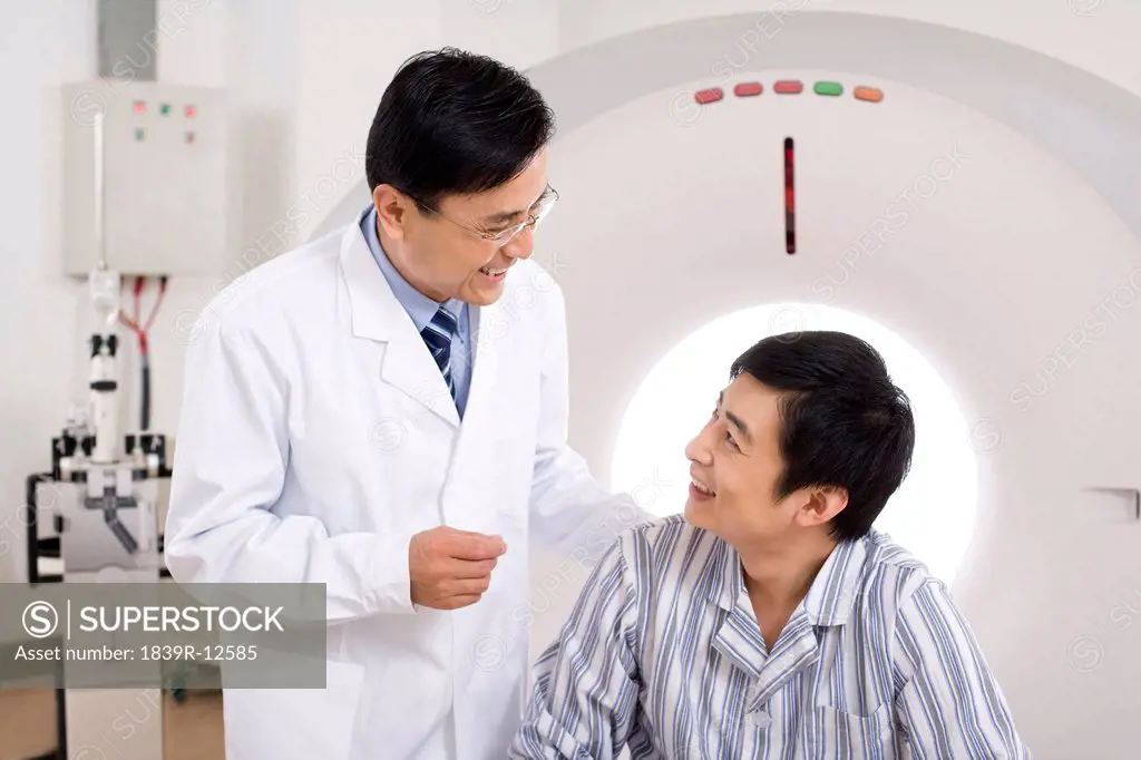 Medical professional and a patient in a MRI scanner