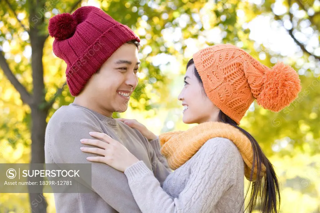 Young Couple in a Park in Autumn