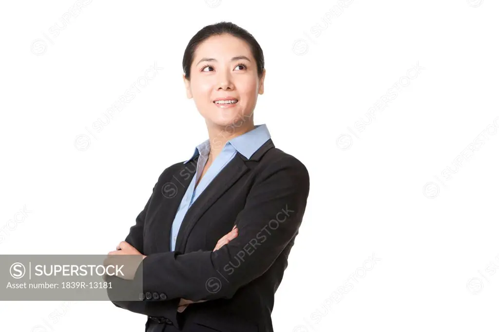 Businesswoman standing with arms crossed