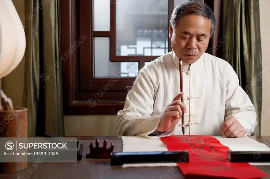 Senior Man Doing Calligraphy