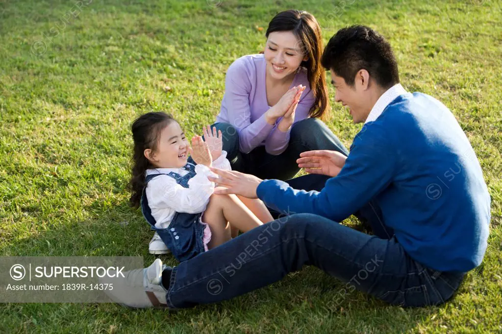 Young family playing in the park