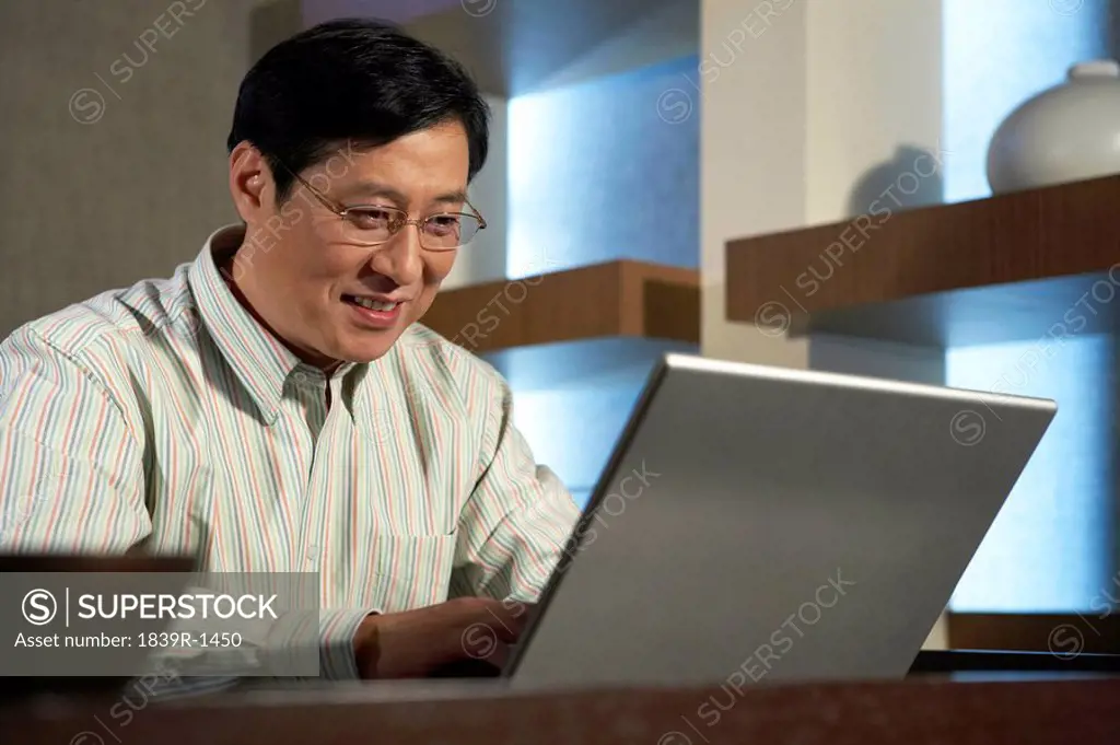Businessman Typing On Laptop