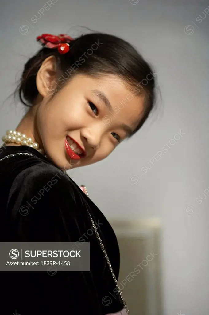 Young Girl Dressed Up Wearing Red Lipstick