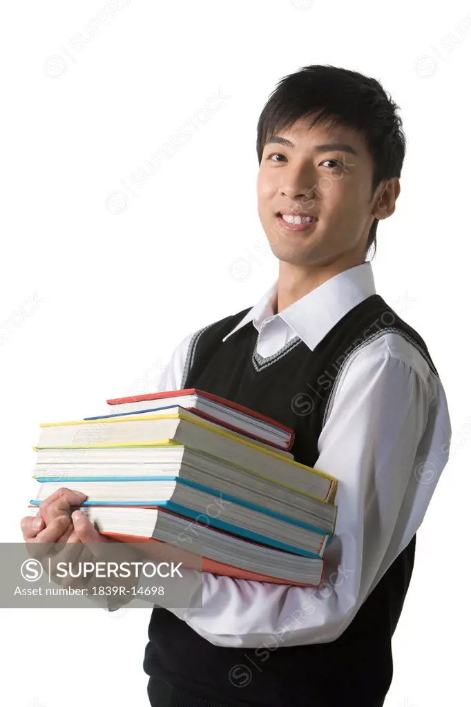 Schoolboy holding his books