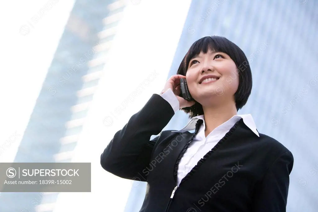 Businesswoman using cellphone