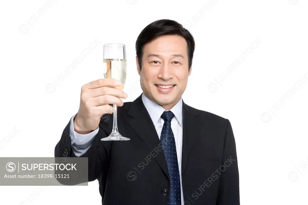 Businessman toasting with champagne