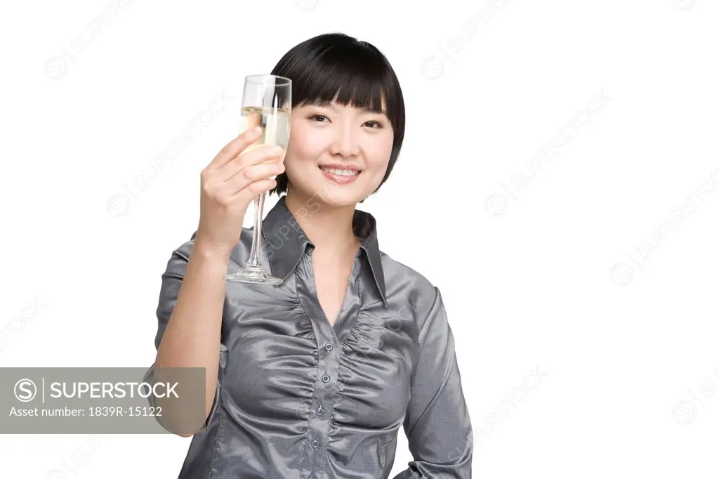 Businesswoman toasting with champagne