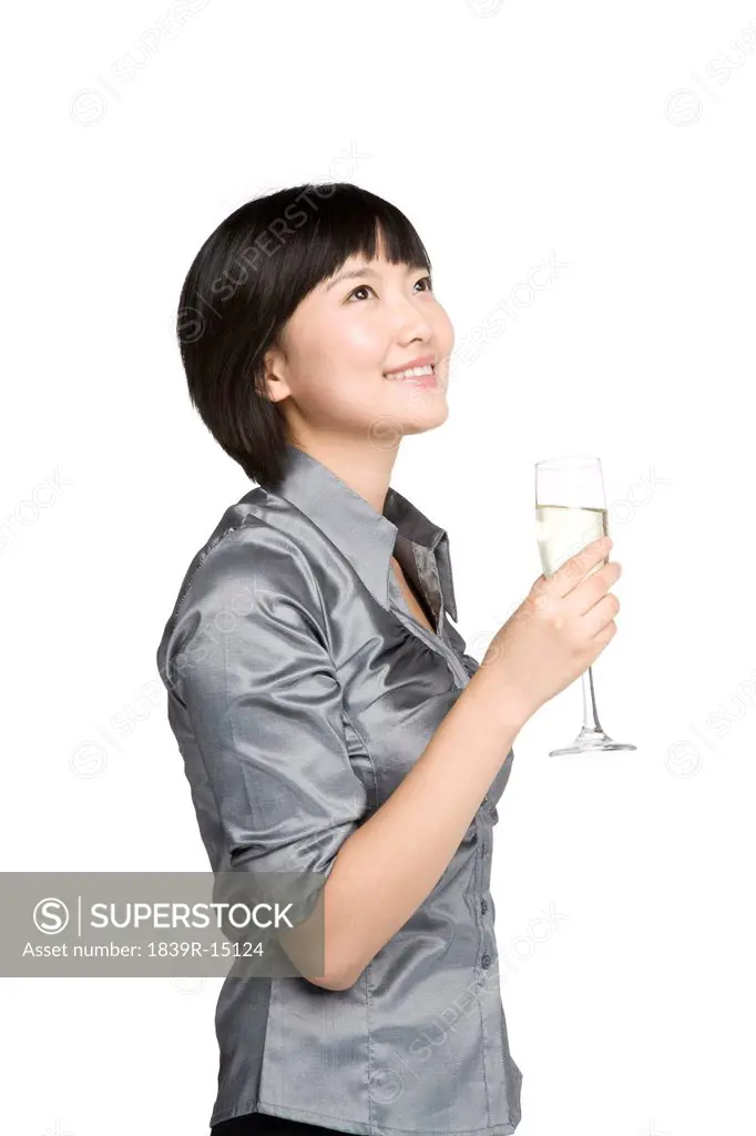 Businesswoman toasting with champagne