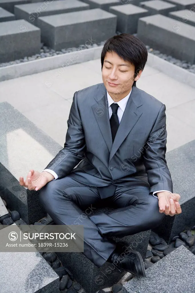 Businessman doing yoga