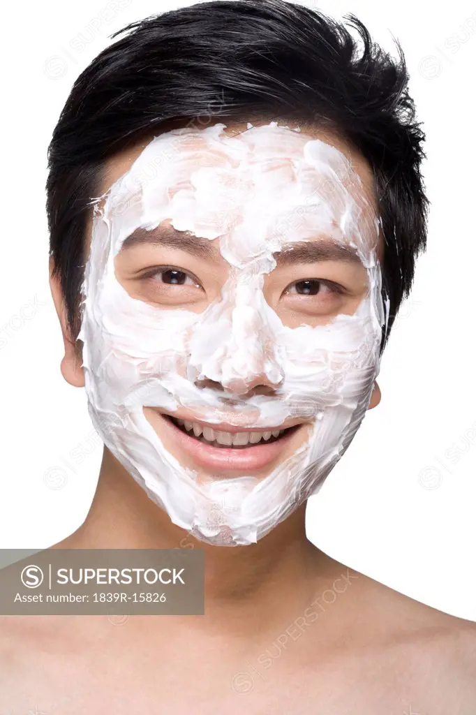 Handsome young man with facial mask
