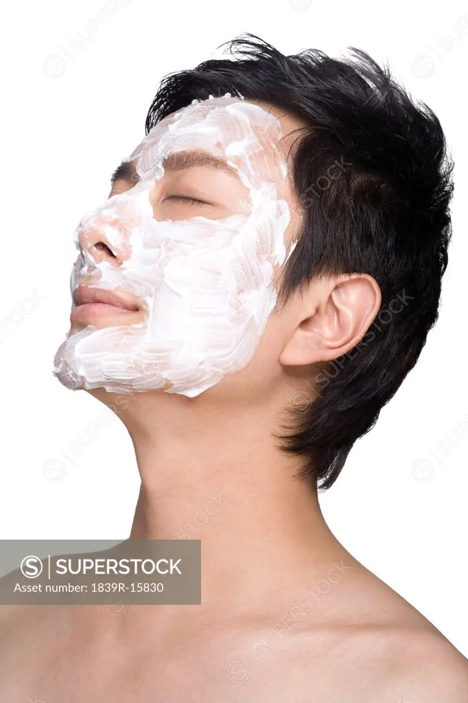 Handsome young man with facial mask