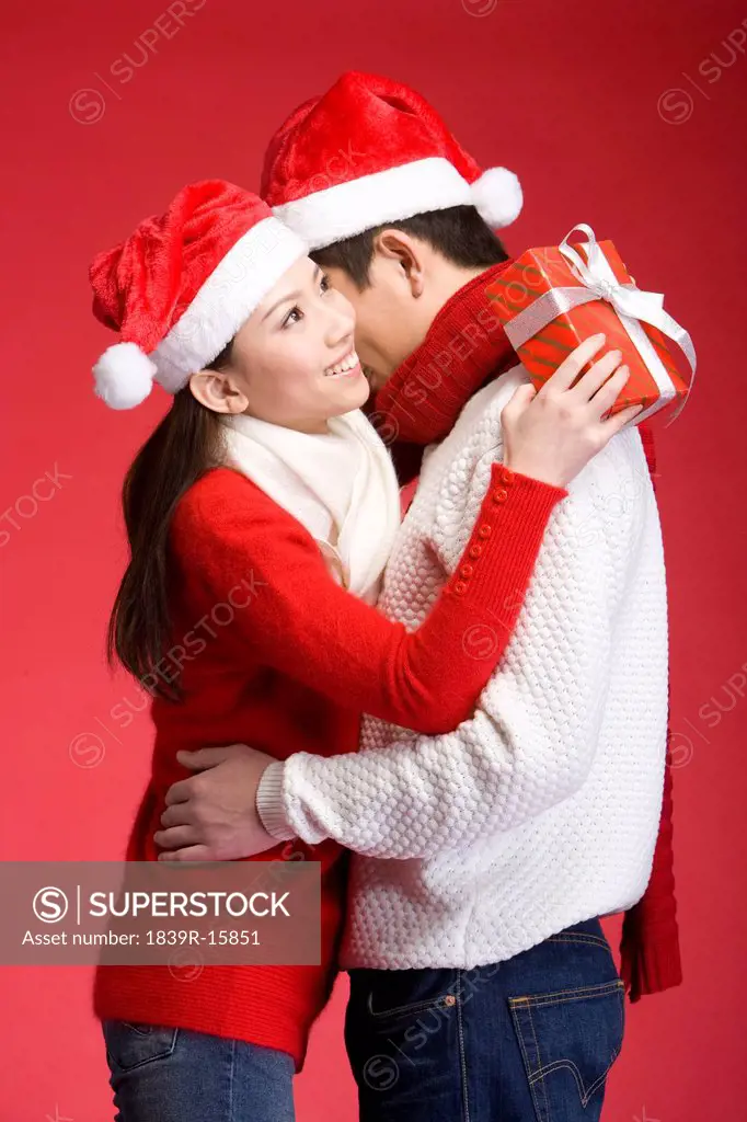 Young couple celebrating Christmas