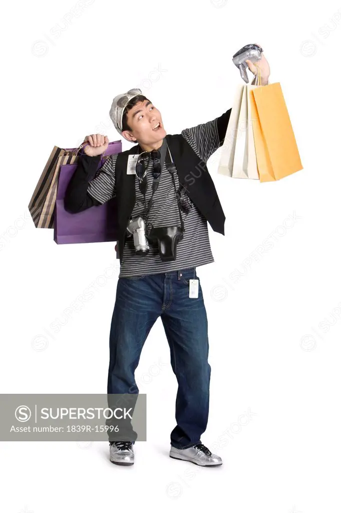 Young man busy shopping