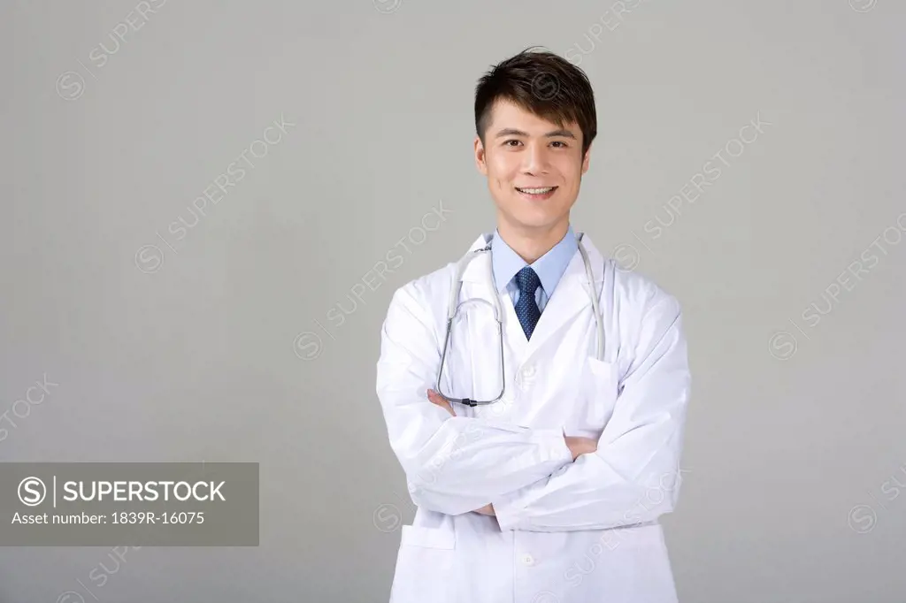 Confident young doctor in labcoat