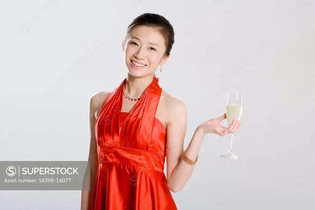 Young woman holding a glass of champagne