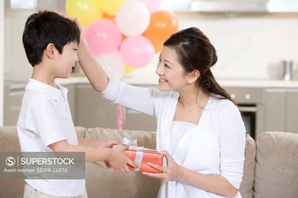 Son gives mother a present