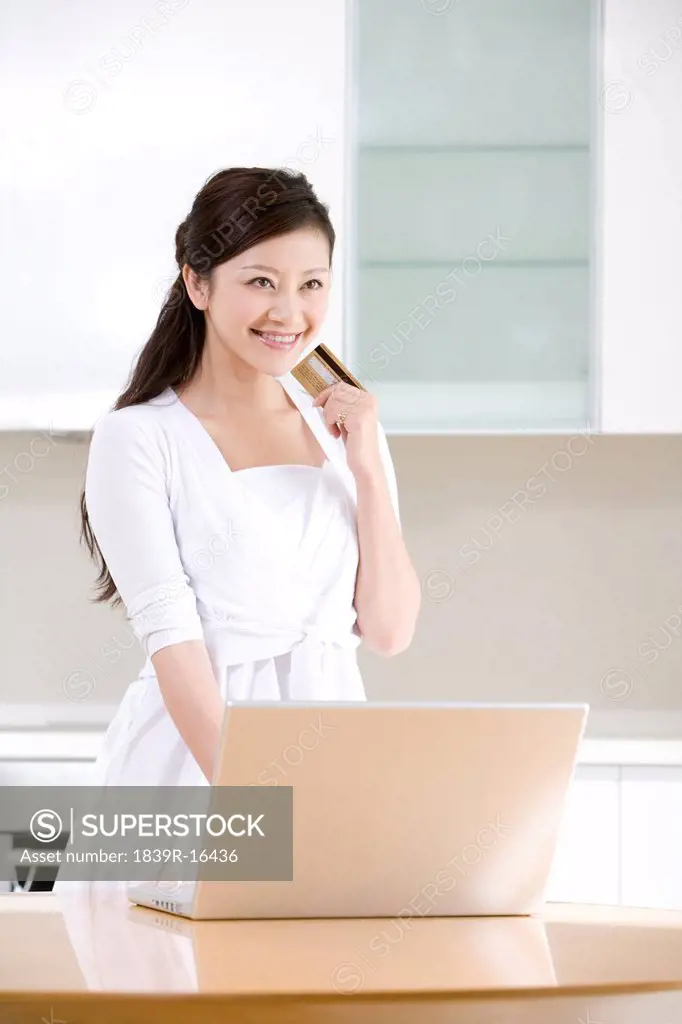 Young woman internet shopping from home