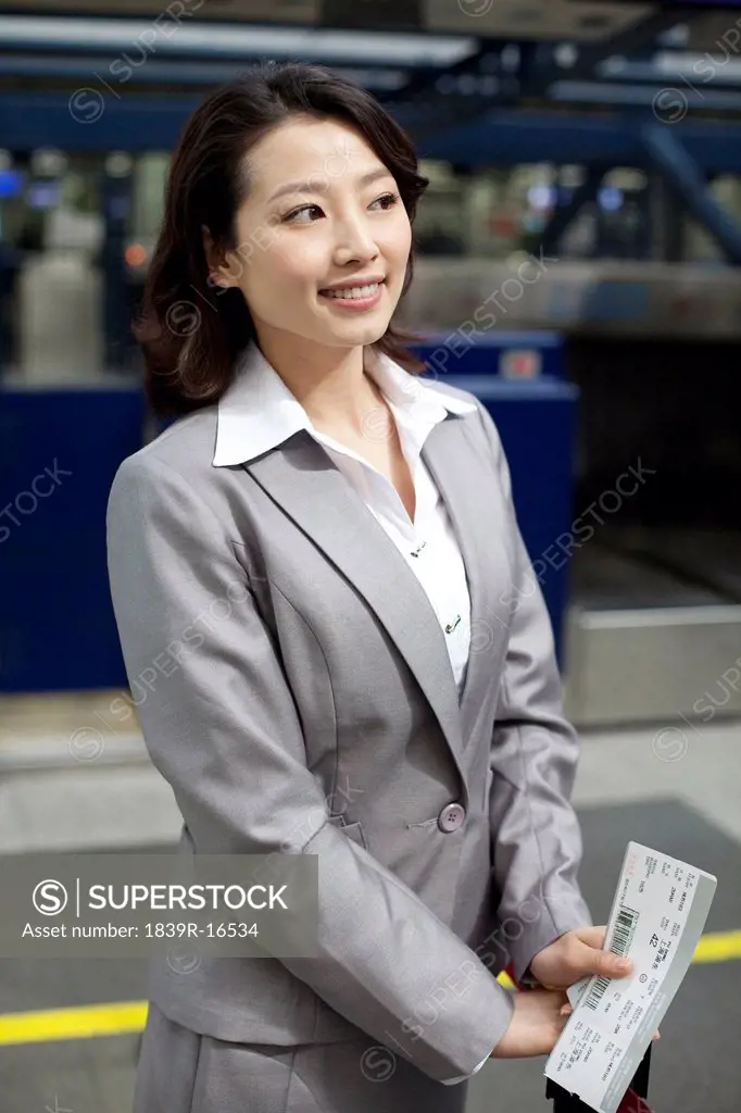 Businesswoman at the airport checkin