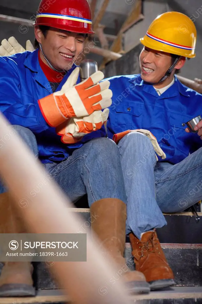 Men In Construction Site Wearing Hard Hats