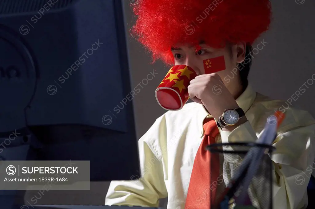 Young Man Wearing Patriotic Costume At Work