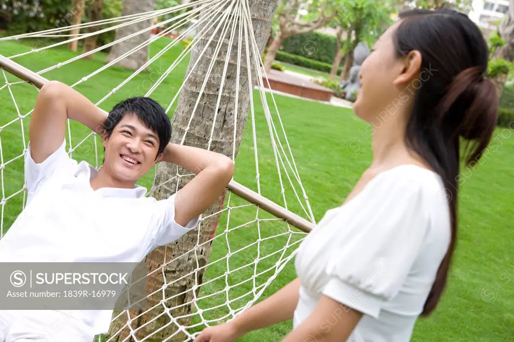 Portrait of a young couple in a hammock
