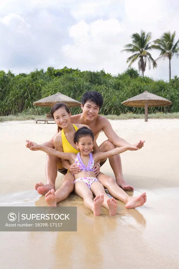 Portrait of a young family at the beach