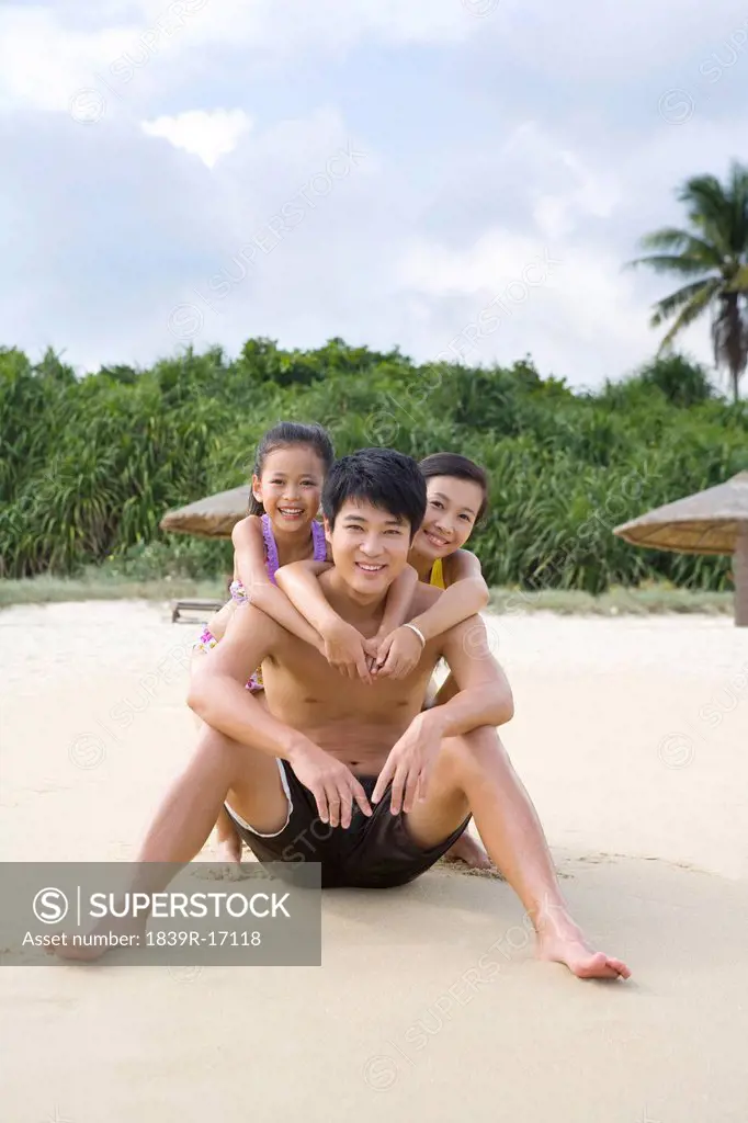 Portrait of a young family at the beach