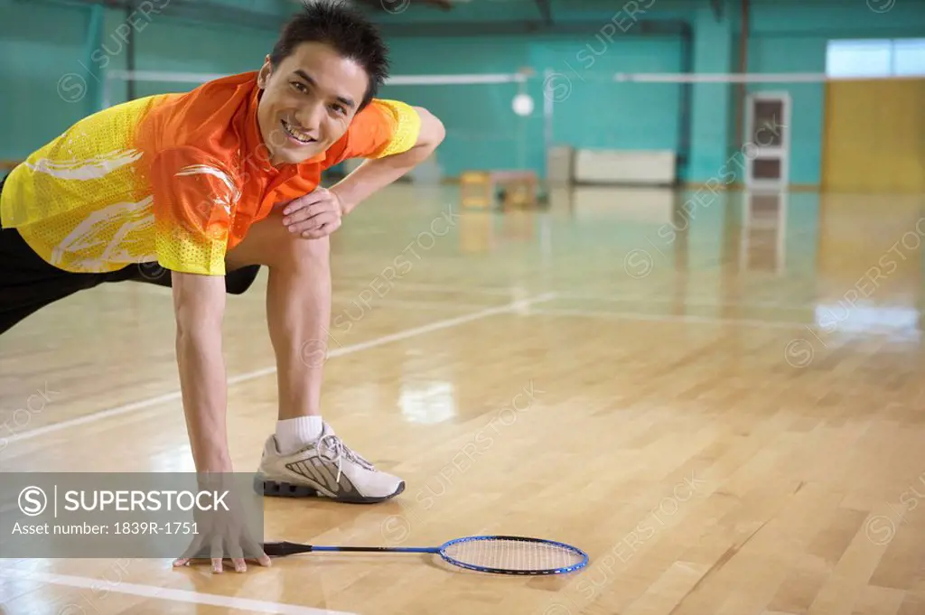 Tennis Player Stretching On Court