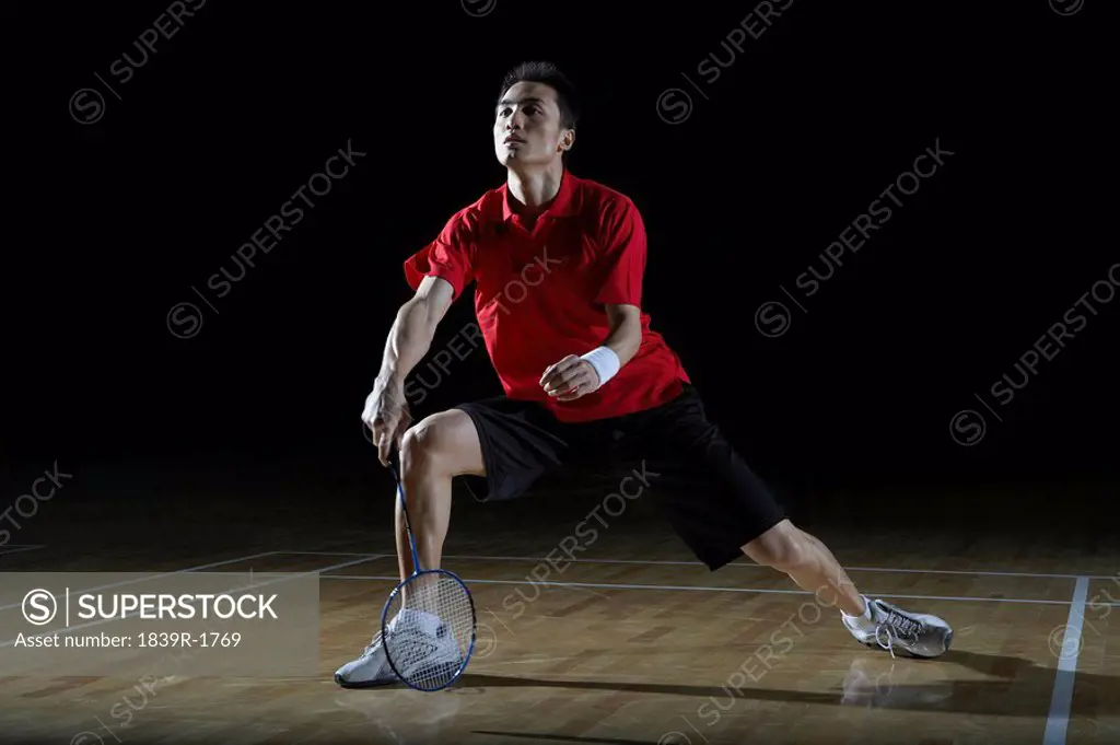 Man In Action Playing Badminton